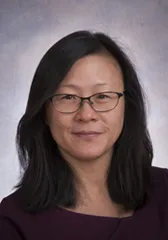 Headshot of Asian woman wearing glasses