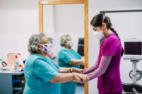 Patient and healthcare professional doing exercises