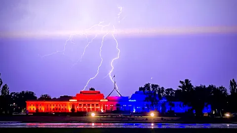 The old Parliament House in Canberra, Australia, lit up in orange for World Cancer Day thanks to ICON Group