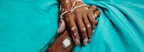 A seventy-year-old patient with melanoma has passed away the palliative care unit at the National Cancer Institute in Mexico City, Mexico on August 28, 2014. His daughter brought him in earlier that day, after traveling with her father for hours because palliative care was not available close to their home. © 2014 Ed Kashi/VII Photo for Human Rights Watch