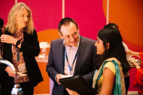 Jeff Dunn speaking with delegates at the 2018 World Cancer Congress