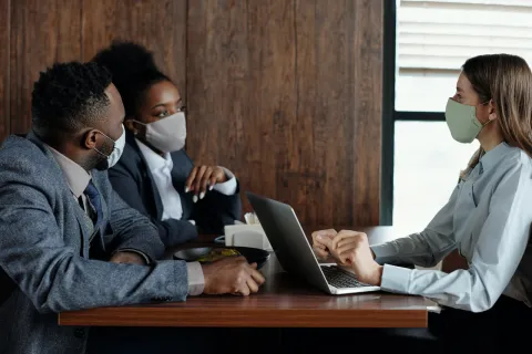 Business people discussing in business attire
