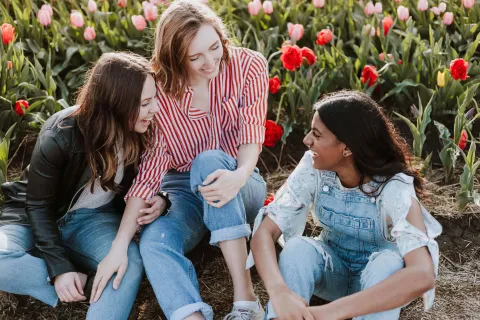 Three women smiling