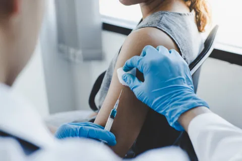 Woman receiving a vaccine shot
