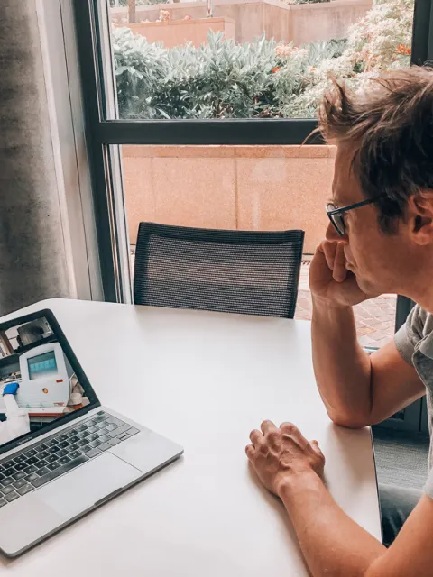 Man looking at video on his computer
