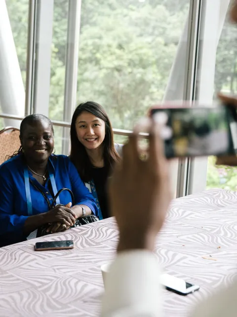 three women taking a photo together