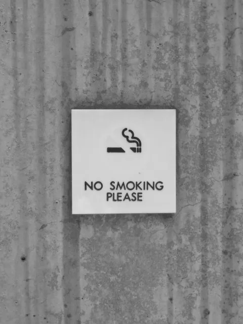 No smoking sign infront of a building