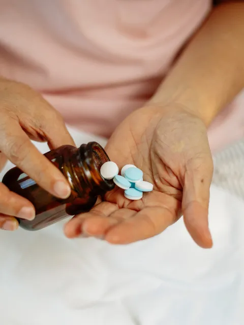 Patient with a bottle of medicines