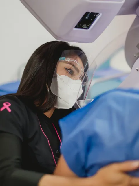 Woman undergoing a mammogram