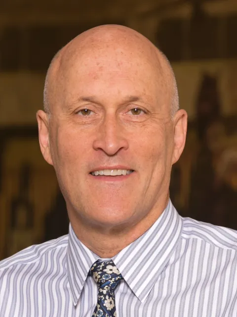 White male in collared shirt and tie