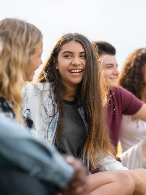 A diverse group of university students gathered, laughing