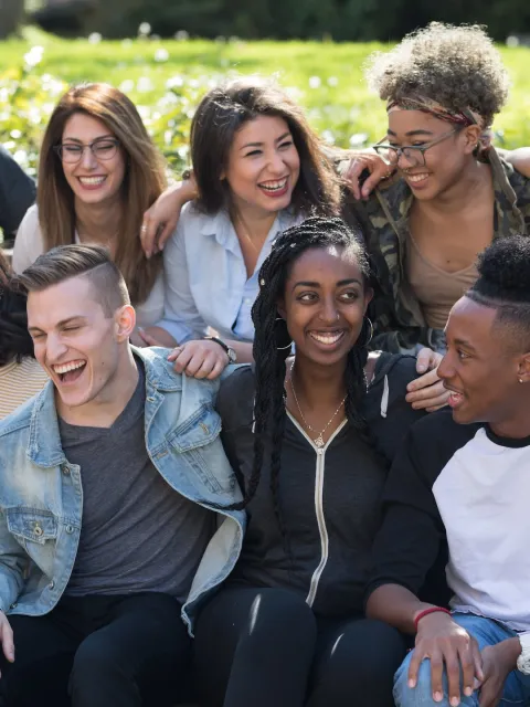 Group photo of a diverse body of students laughing