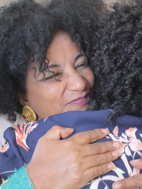 Two African women hugging