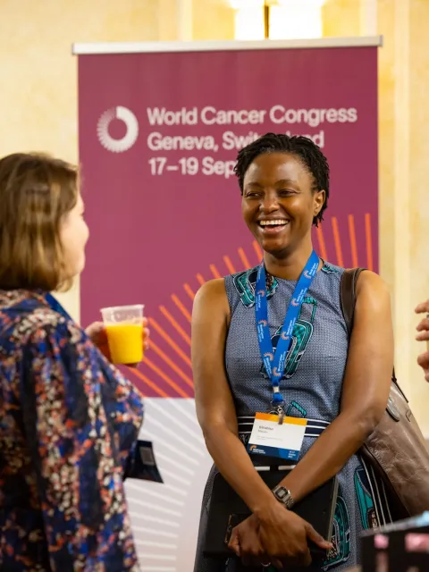 Four women at a medical conference talking