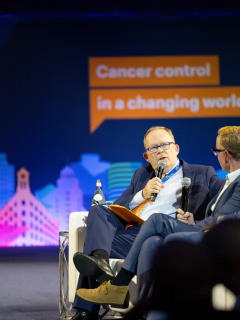 Dr Cary Adams speaking at the 2023 World Cancer Leaders' Summit in Long Beach