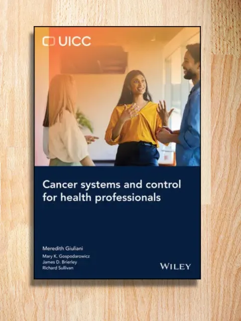 Cancer Systems book cover on a desk
