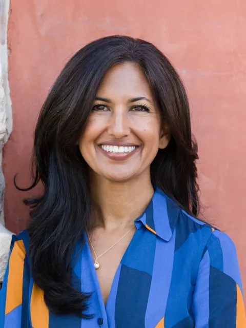 Headshot of Asian woman in blue dress