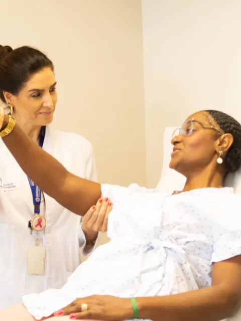 Black woman examined by a female doctor for breast cancer