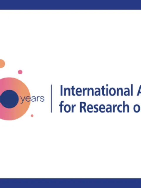 Branded poster for the 60th anniversary of the International Agency for Research on Cancer