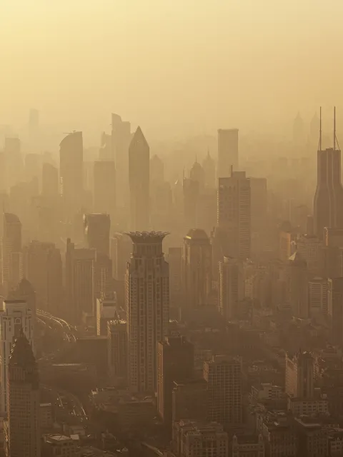 Air pollution seen over Shanghai's Puxi District buildings at dusk 