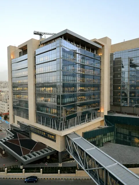 Glass faced building, about 10 stories high
