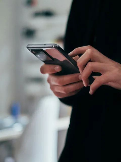 close up of hands on a smartphone