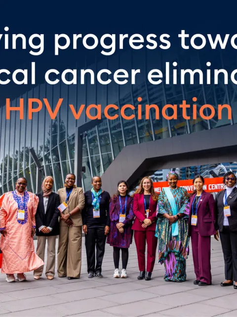 Diverse group of women outside a convention centre, with the text overlay "Driving progress on HPV vaccination"