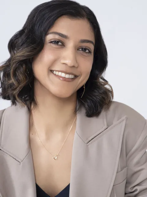 Young Asian woman in suit, headshot