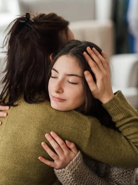 Two women hugging