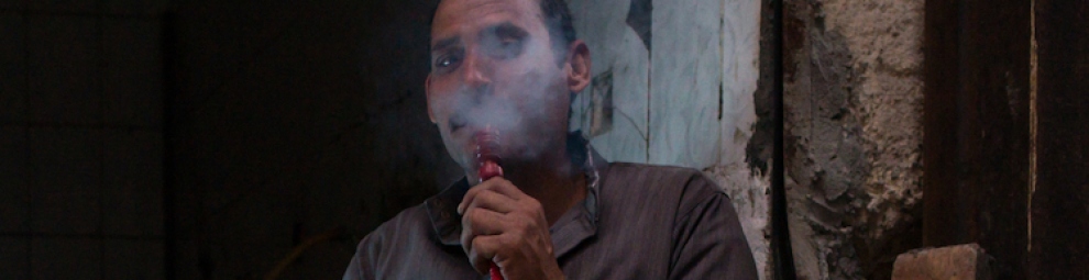 Middle Eastern man smoking a hookah