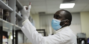 Healthcare worker looking at a sample at the pathology department at the  Aga Khan University Hospital in Kenya