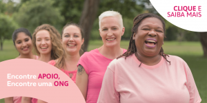 Women smiling dressed in pink for Breast Cancer Awareness Month