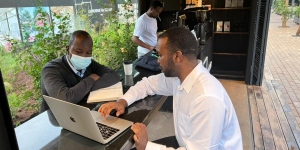 UICC alumni Young Leaders, Dr Kingsley I. Ndoh, Founder and Chief Strategist of Hurone AI, and Dr Francois Uwinkindi, Non-Communicable Diseases Division Manager at Rwanda Biomedical Center, which is helping deploy a test version of the health app Guzika in Rwanda.