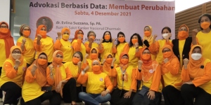 Participants at a workshop organised by the Indonesian Cancer Information and Support Center Association (CISC), dressed in yellow and orange colours and wearing masks