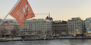 Branded World Cancer Day flag on the Mont Blanc bridge in Geneva for World Cancer Day 2023