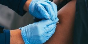 Women receiving a vaccine shot