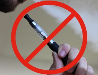 e-cigarette smoker with an "interdiction" sign over it